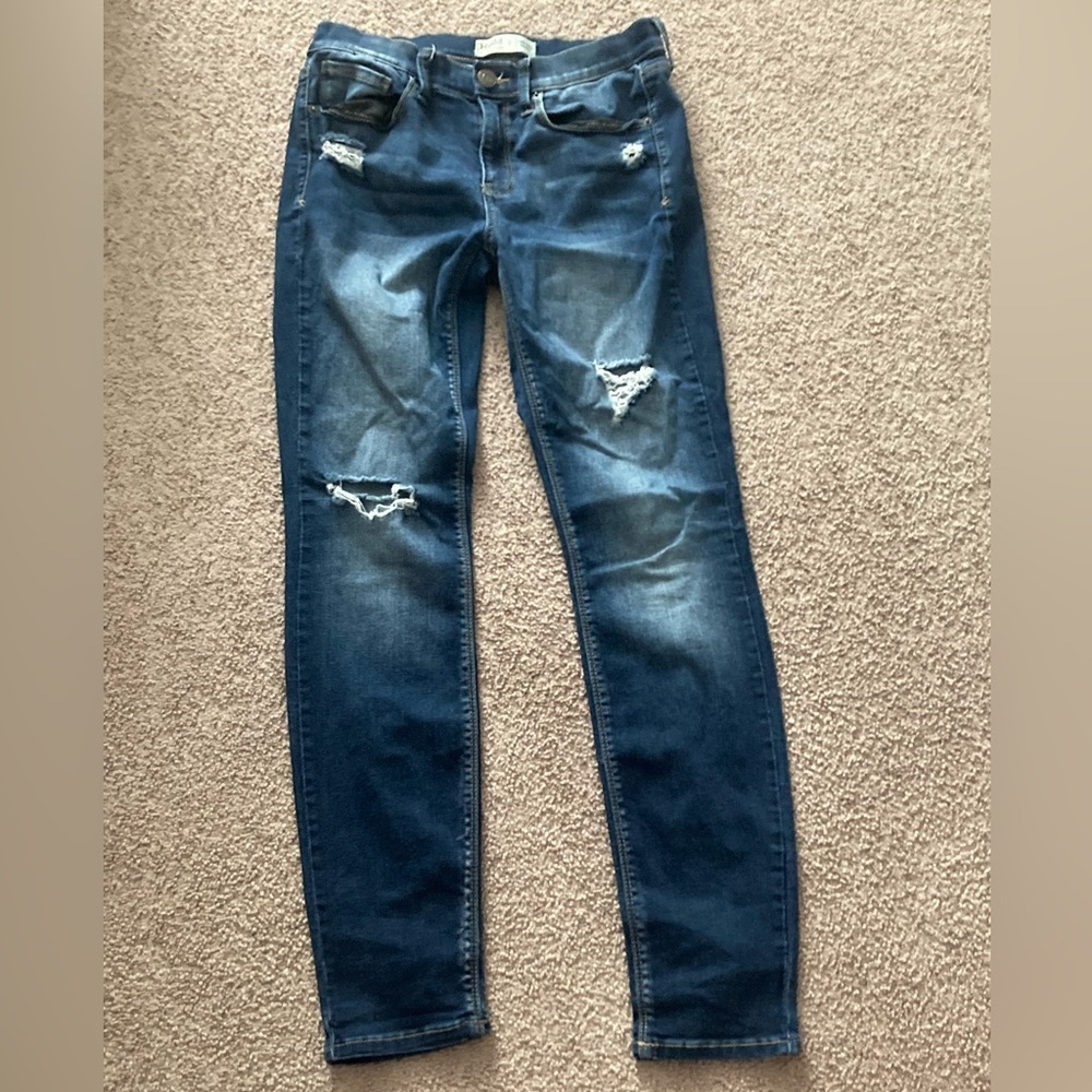 Dark blue jeans with rips